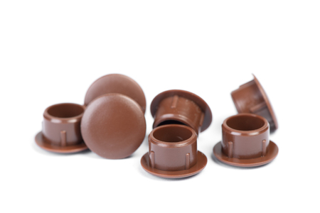 Plastic plugs for furniture screws with cup heads isolated on white backgroundの写真素材