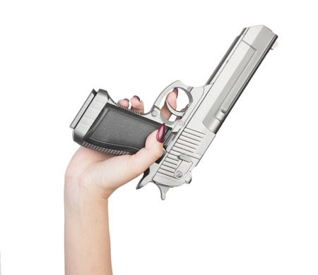 Pistol in female hand isolated on white background