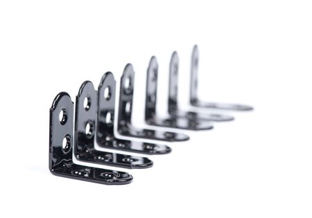 Group of  black metallic angle fixators. Mounting metal angle corners brackets isolated on white...
