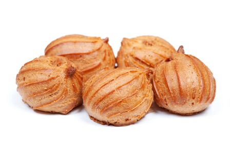 Group of small custard cakes isolated on white