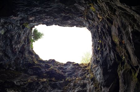 Hole in the rocky cave inside from bottom to top upwards