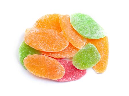 Stack of colored candied fruit isolated on white backgroundの写真素材