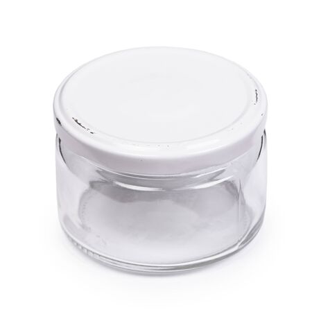 Small empty glass jar with a lid isolated on white backgroundの写真素材