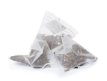 Pyramid shape tea bags isolated on white backgroundの写真素材