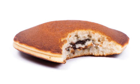 One bitten pancake isolated on a white backgroundの写真素材