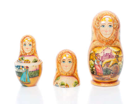Group of Russian nesting dolls (also named as Matrioshka) isolated over white background. Wooden doll souvenir.の写真素材