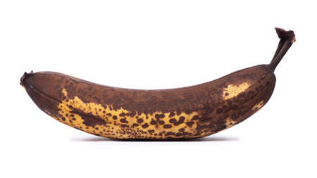 One old overripe banana isolated on white backgroundの写真素材