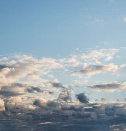 Blue sky background with cloudsの写真素材