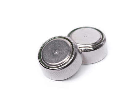 Group of button cell isolated on white background. Small watch lithium batteriesの写真素材