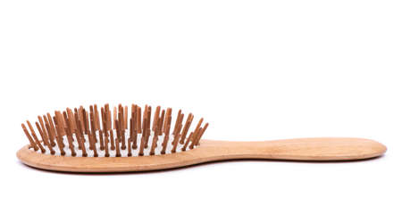 Single wooden massage brush, comb isolated on white background