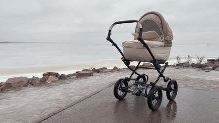Lonely stroller outside in cold winterの写真素材