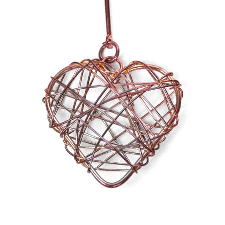 Braided wire heart isolated on white backgroundの写真素材