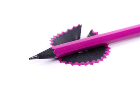 Black pencil shavings isolated on white backgroundの写真素材