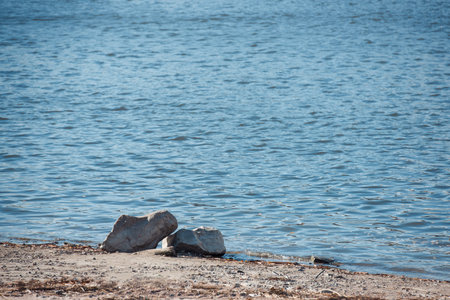 Two stone rocks on the lake shoreの写真素材