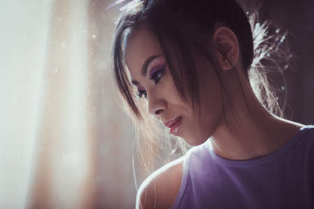 Indoor candid portrait with sun lightingの写真素材