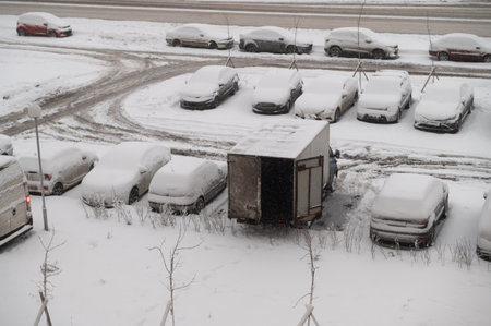Unloading of a van at snowy winterの写真素材
