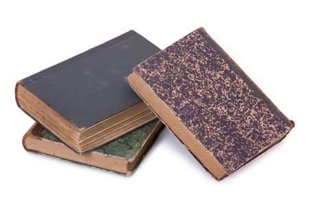 Stack of old vintage books isolated on white backgroundの写真素材