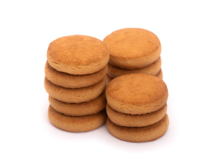 Group of simple round cookies isolated over white backgroundの写真素材