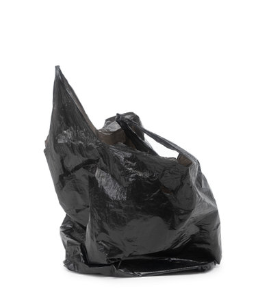 Black empty plastic bag isolated on white backgroundの写真素材