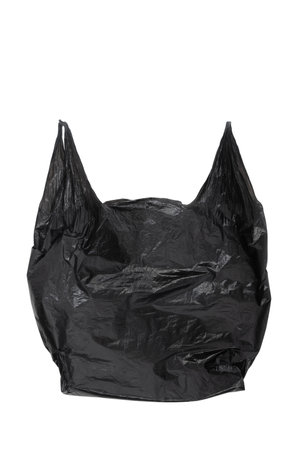 Black empty plastic bag isolated on white backgroundの写真素材