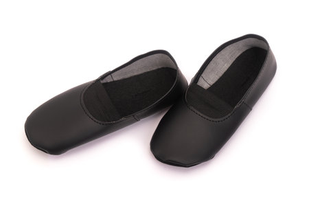 Pair of new black dance shoes, slippers isolated on white backgroundの写真素材