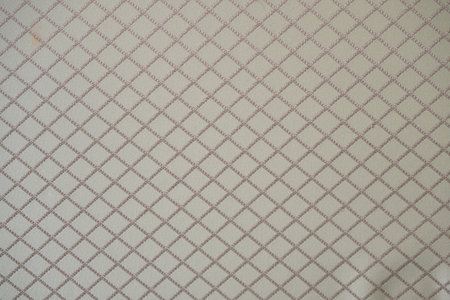 Close-up of textured fabric with rhombus patternの写真素材