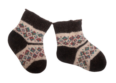 Warm woolen knitted socks isolated on white backgroundの写真素材