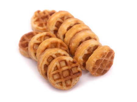 Group of small round tasty waffles isolated on white backgroundの写真素材