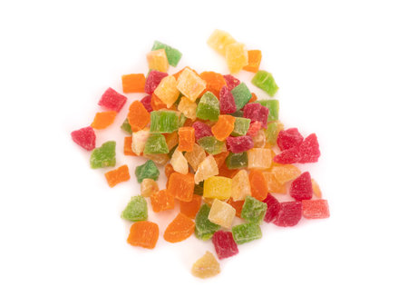 Pile of colorful dried fruit pieces isolated on white backgroundの写真素材