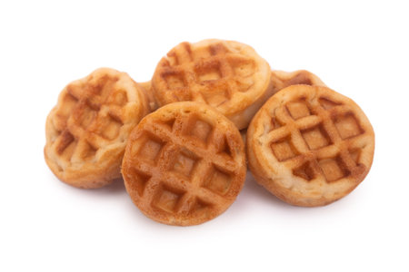 Group of small round tasty waffles isolated on white backgroundの写真素材