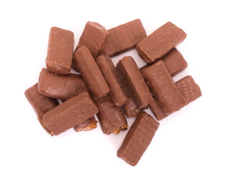 Group of broken chocolate bars isolated over white backgroundの写真素材