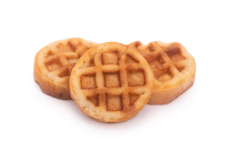 Group of small round tasty waffles isolated on white backgroundの写真素材