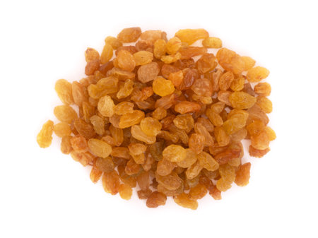 Pile of yellow raisins isolated on white backgroundの写真素材