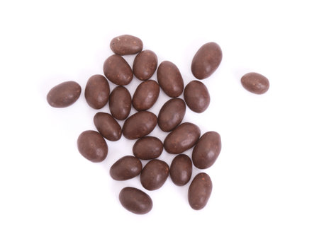 Peanuts covered in chocolate isolated on whiteの写真素材