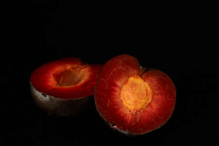 plums lie on the kitchen table, fruitsの写真素材