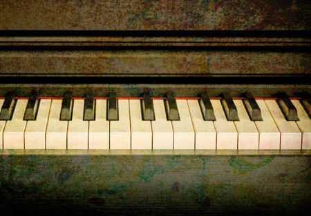 Piano keyboard on grunge background with space for text or imageの写真素材