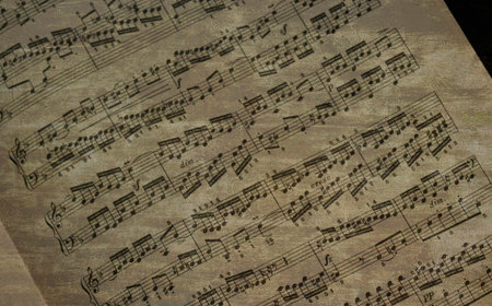 Music notes on the old paper, close-up. Music backgroundの写真素材