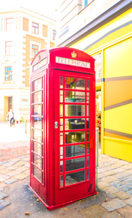 Red telephone box in London, UK - retro vintage effect style pictures