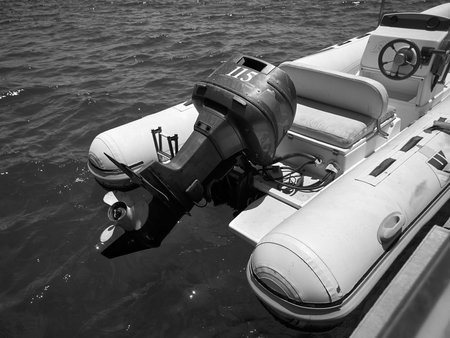 Boat in the sea. Black and white image of a motor boat.