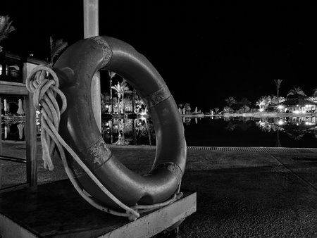 Lifebuoy on the beach at night, Black and white.の写真素材