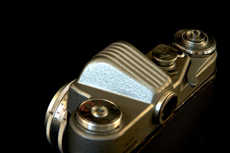 Retro camera on a black background. Shallow depth of field.
