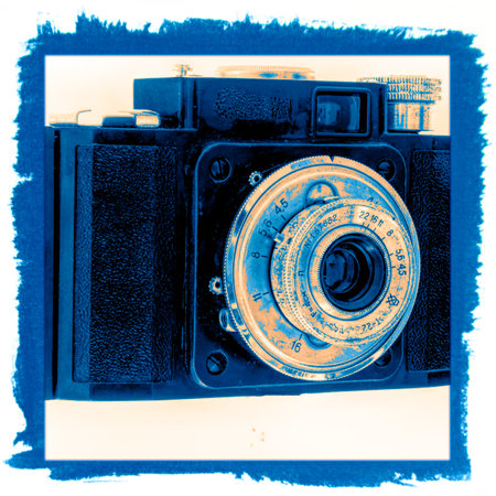 Vintage camera on a blue background with space for your text.