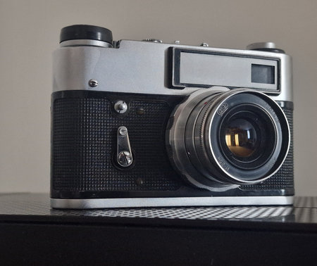 Retro camera on a gray background. Close-up view.の写真素材