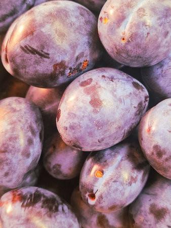 Fresh plums on display at a farmers market in Southern California.の写真素材
