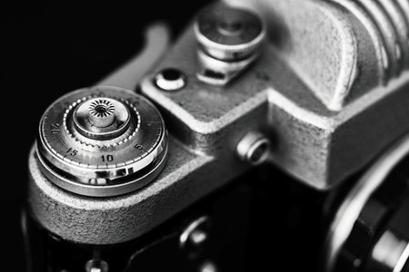 Vintage camera on a black background. Shallow depth of field.の写真素材