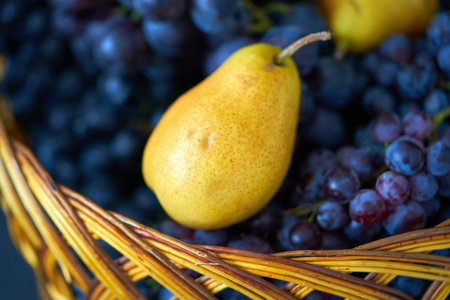 basket of grapes and pear, shallow depth of field, selective focusの写真素材