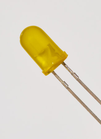 Yellow led diode isolated on white background. Close up of yellow diode.の写真素材