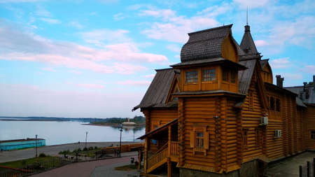 large swarm wooden house on the river bank