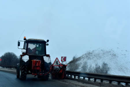 Tractor removes snow winter