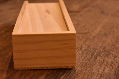 Game of dominoes in a wooden box
